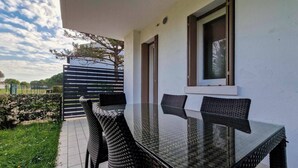 Apartment, 2 Bedrooms | Outdoor dining - Sunny Retreat With Solarium (San Michele al Tagliamento)