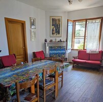 Family Villa | Living area | 32-inch flat-screen TV with cable channels