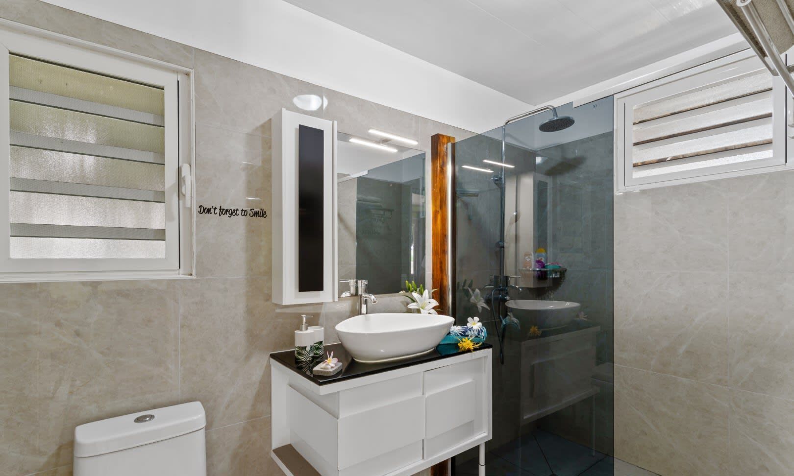Shower, hair dryer, towels, shampoo