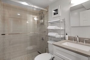 Shower, hair dryer, towels, shampoo