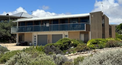 Absolute Beachfront on the cliff with easy stair access to the beach (BYO LINEN)