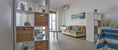 Comfort Apartment | Living area | 32-inch flat-screen TV with cable channels