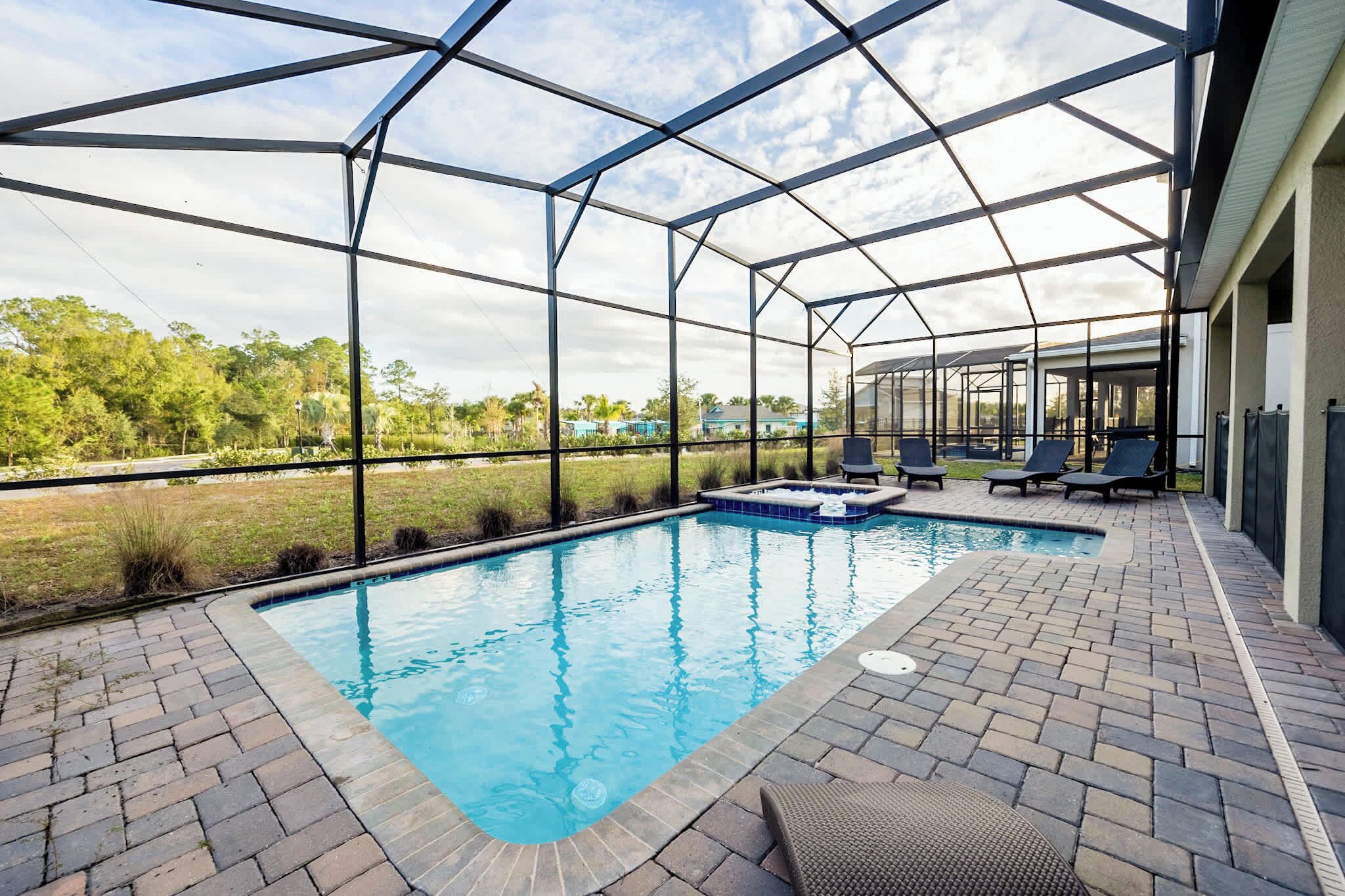 Relax in your private screened-in pool and hot tub oasis, perfect for unwinding after a day of adventure.