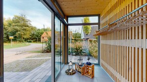 Relax in this open-plan living space with a seamless view of the surrounding area.