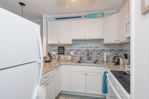 Fridge, microwave, stovetop, coffee/tea maker