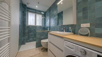 Shower, hair dryer, towels, soap