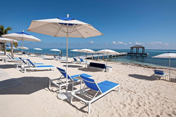 On the beach, sun loungers, beach towels