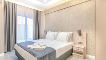 Egyptian cotton sheets, premium bedding, minibar, in-room safe