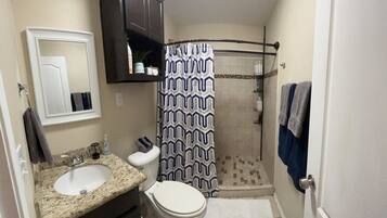 Shower, hair dryer, towels, soap