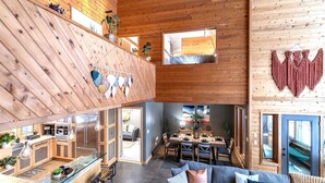 A spacious loft-style interior with a kitchen, dining area, and seating space. - Rapids Rustic Retreat (Wisconsin Rapids)