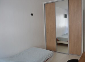 1 bedroom, desk, iron/ironing board, travel crib
