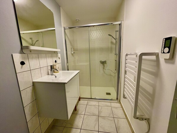 Shower, hair dryer, towels, soap