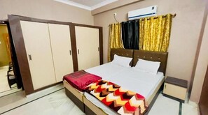 Relax in this inviting space with a large bed and ample storage in the wardrobe.