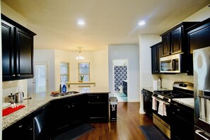 Coffee/tea maker, fridge, microwave, oven