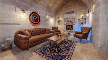 Panoramic Suite, Fireplace, City View | Living area | 100-cm Smart TV with digital channels, Netflix, heated floors