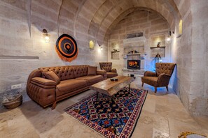 Panoramic Suite, Fireplace, City View | Living area | 100-cm Smart TV with digital channels, Netflix, heated floors