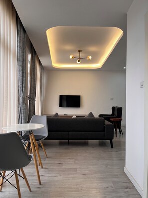 Junior Room, 1 Bedroom | Living area | 43-inch Smart TV with satellite channels, printers - Zemilo hotel apartment (Addis Ababa)