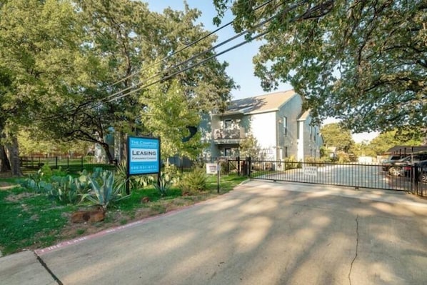 A gated property with a sign indicating leasing.