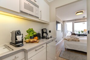 Fridge, microwave, stovetop, coffee/tea maker