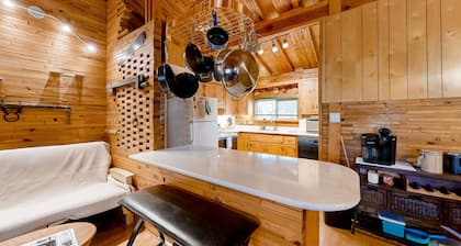 Dog-friendly rustic retreat with enclosed yard, grill, wood stove, games, & W/D