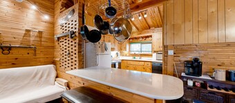 Dog-friendly rustic retreat with enclosed yard, grill, wood stove, games, & W/D