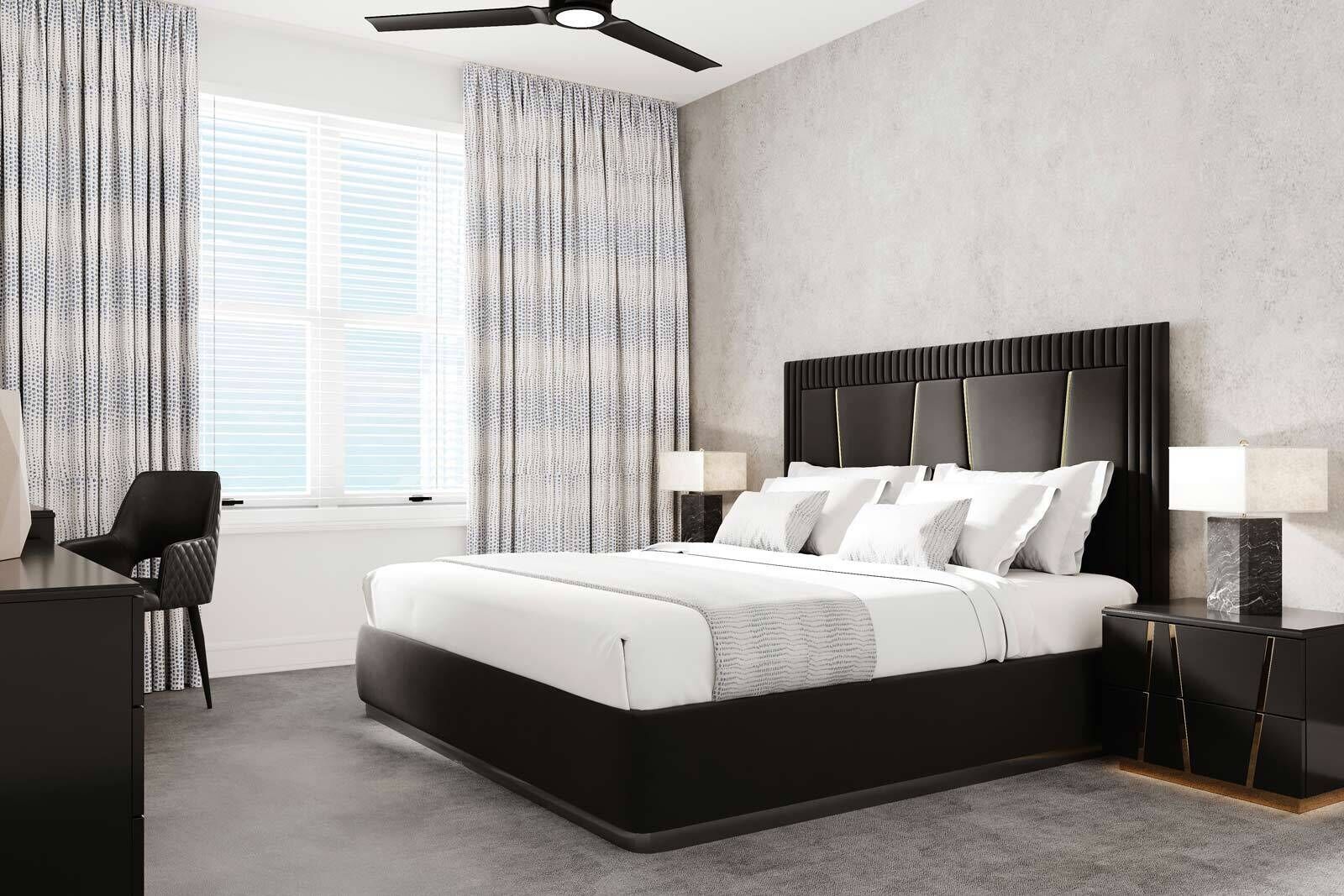 A modern bedroom with a large bed, a desk, and a chair.