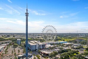 A tall tower and a Ferris wheel in a cityscape. - Vor5408aa: 4 Bed, Dragon's Den, Pool (Orlando)