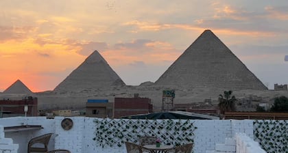 Chez l’ami hotel. It’s a family house that has the view of the 3 pyramids.