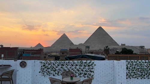 Chez l’ami hotel. It’s a family house that has the view of the 3 pyramids.