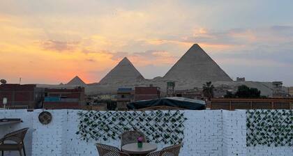 Chez l’ami hotel. It’s a family house that has the view of the 3 pyramids.