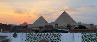 Chez l’ami hotel. It’s a family house that has the view of the 3 pyramids.