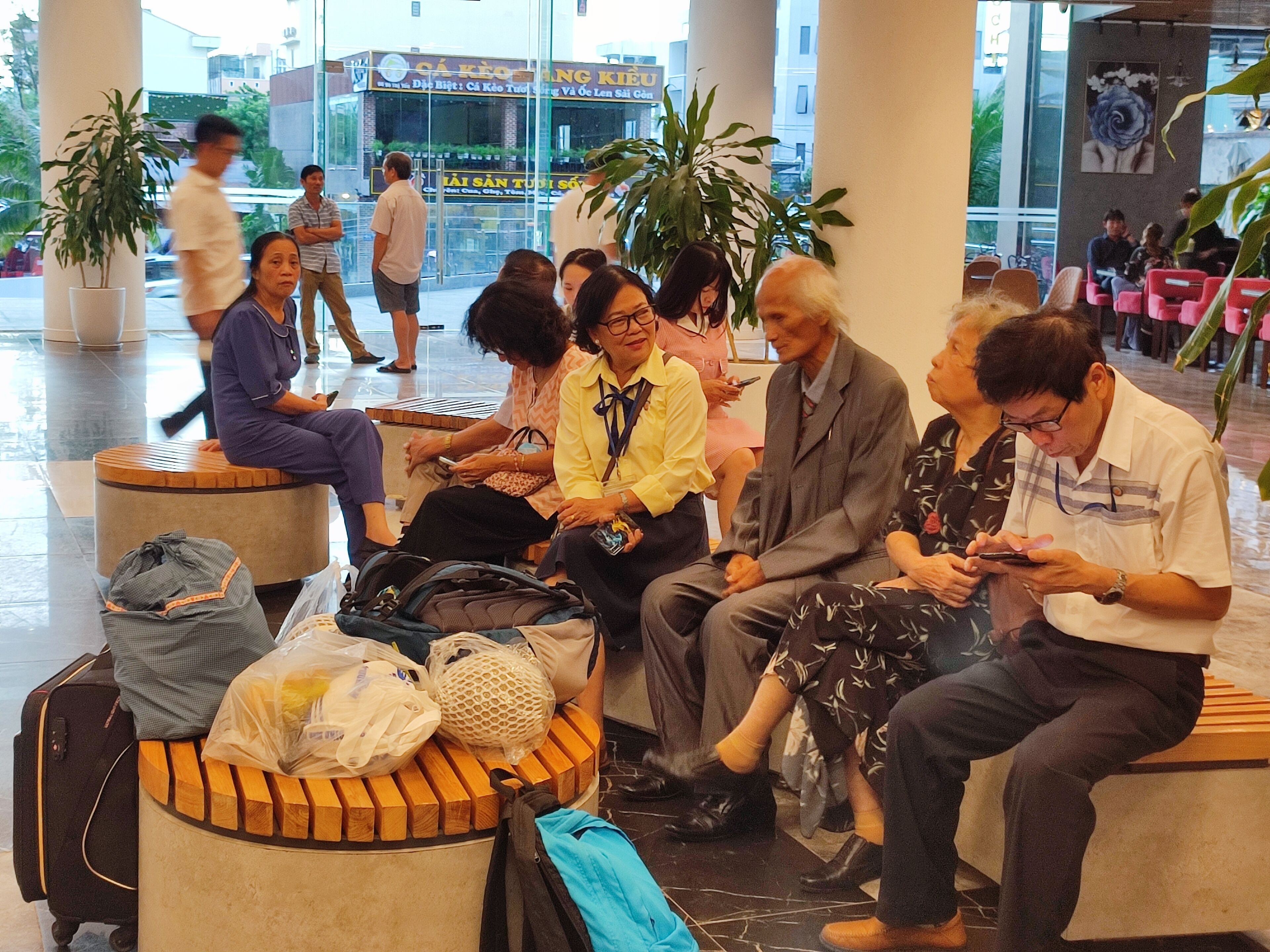 A waiting area with seating and luggage.