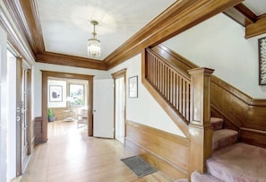 Stunning interior with a grand staircase and elegant design.