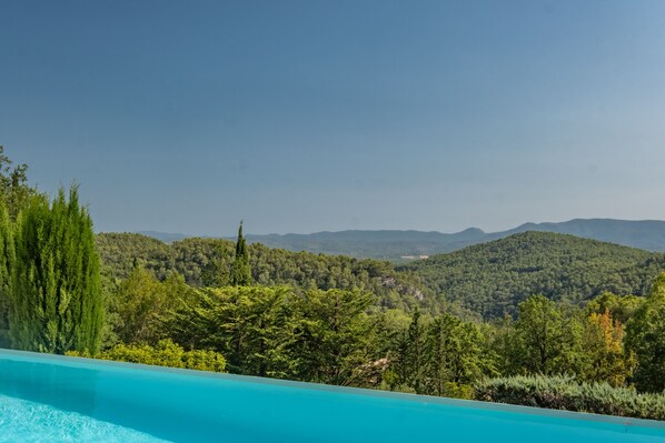 Surrounded by lush greenery and rolling hills, this serene setting offers a tranquil escape.