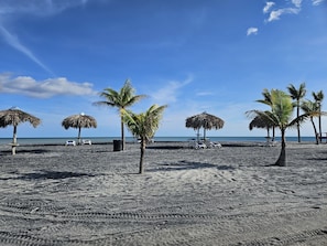 On the beach, sun-loungers