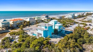A coastal residential area with beachfront properties, a swimming pool, and a clear view of the ocean. - Pool | Elevator | Sleeps 10 (Cape San Blas)