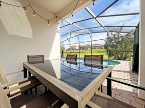 Outdoor dining - Upgraded pool home with hot tub and games/movie room - gated resort 6 miles from Disney! (Clermont)