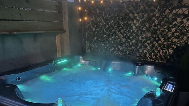 A hot tub with a digital control panel and LED lighting. - Modern house with a Tub!!! (Bangor)