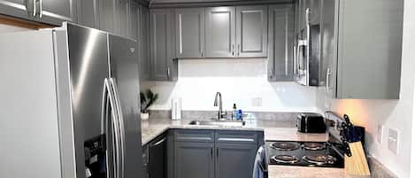 Coffee/tea maker, fridge, microwave, oven