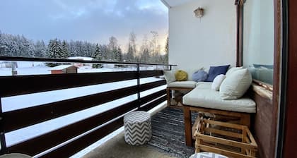 At the foot of the slopes balcony with view and wood-burning stove