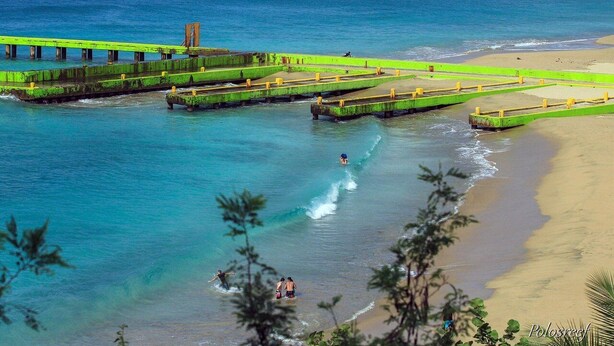 A coastal area with a beach, a pier, and boats in the water. - Cozy and Peacefull  (Aguadilla)