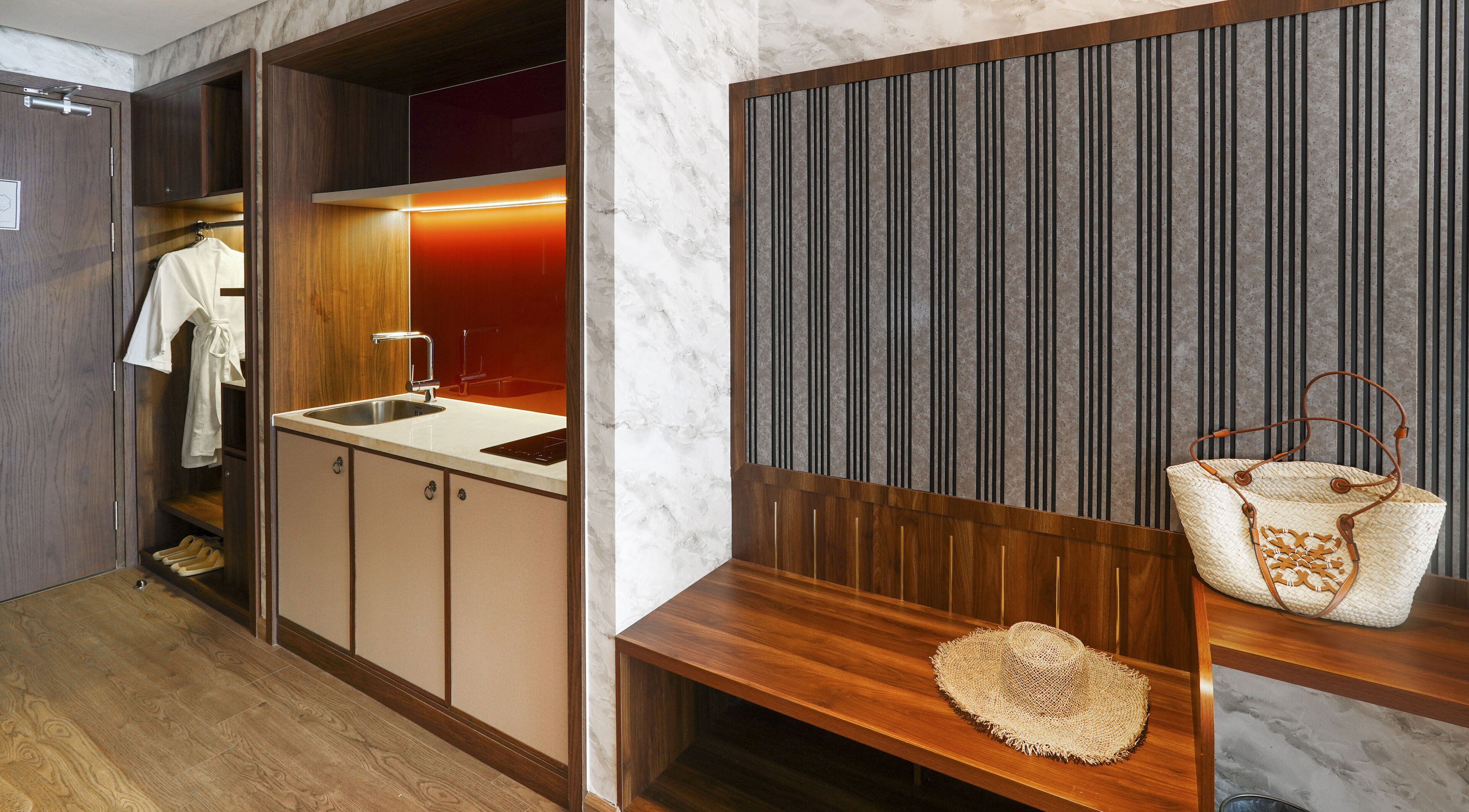 A modern bathroom with a wooden vanity, a sink, and a mirror.