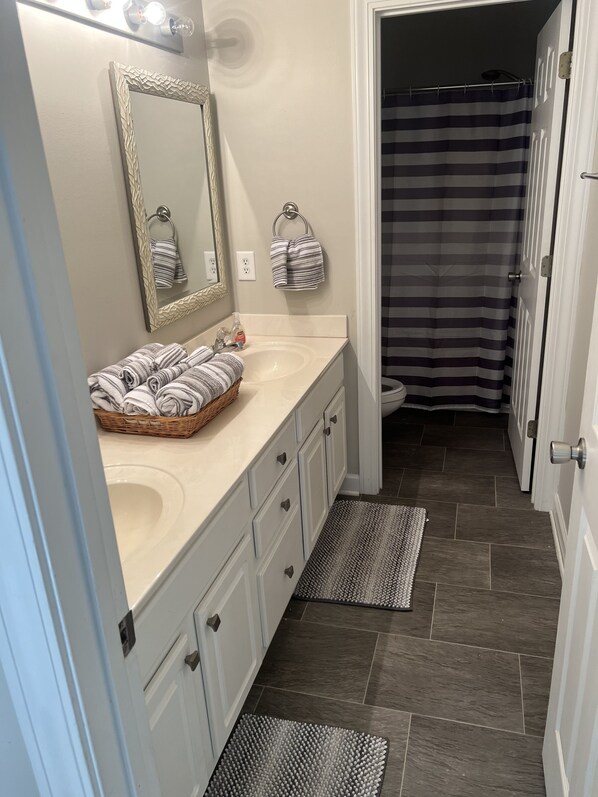 Jetted bath, hair dryer, towels, soap