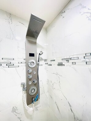Shower, hair dryer, towels, soap