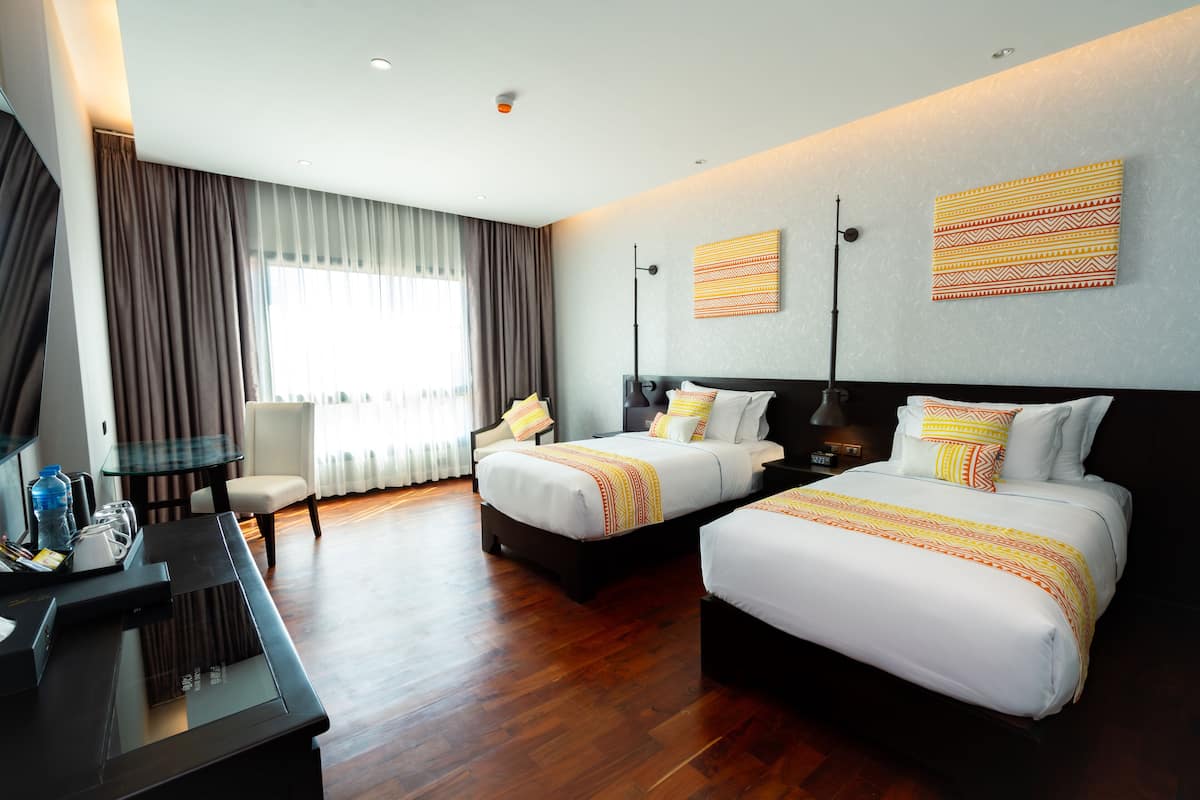 Luxe beddengoed, een minibar, een kluis op de kamer, een bureau