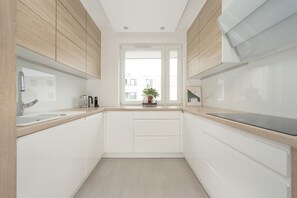 Apartment, 1 Bedroom, Balcony | Private kitchen | Microwave, dishwasher, coffee/tea maker, electric kettle - Apartment in Wroclaw by Renters Prestige (Wroclaw)