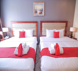 Family Quadruple Room | Minibar, desk, blackout drapes, soundproofing
