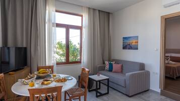 Executive Apartment, 1 Bedroom | Living area | 42-inch flat-screen TV with digital channels, Netflix