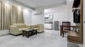 Standard Apartment | Living area | 32-inch TV with cable channels