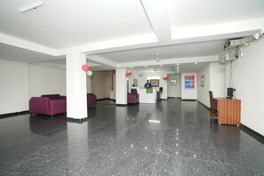 Relax in the stylish lobby with comfortable seating and a convenient desk area.